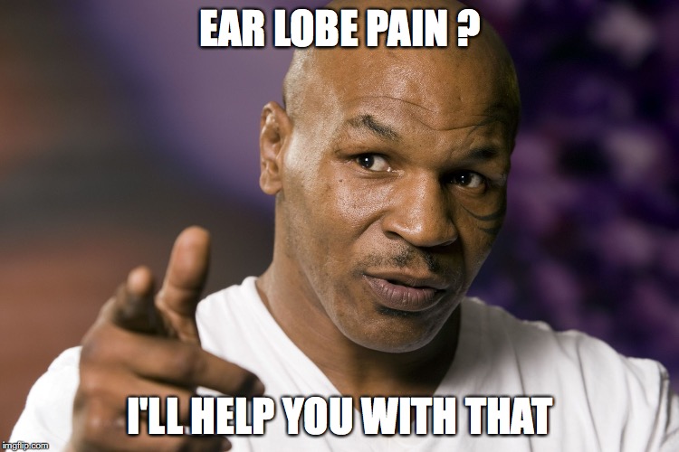 Mike Tyson  | EAR LOBE PAIN ? I'LL HELP YOU WITH THAT | image tagged in mike tyson | made w/ Imgflip meme maker