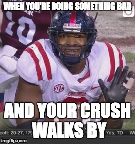 WHEN YOU'RE DOING SOMETHING BAD; AND YOUR CRUSH WALKS BY | image tagged in college football | made w/ Imgflip meme maker