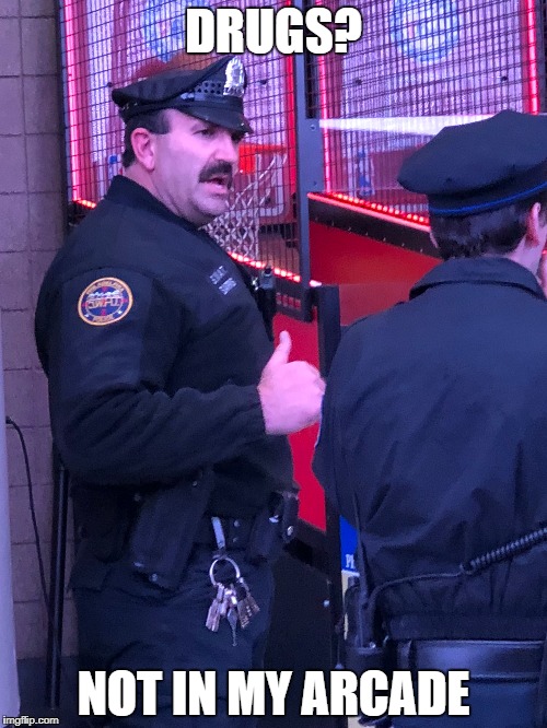 Bad-ass Cop at Arcade | DRUGS? NOT IN MY ARCADE | image tagged in cop,arcade,badass,thumbs up | made w/ Imgflip meme maker