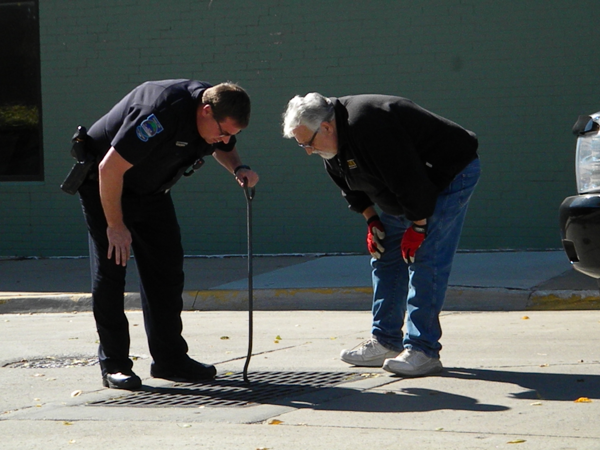 two men looking down into a sewer Blank Meme Template