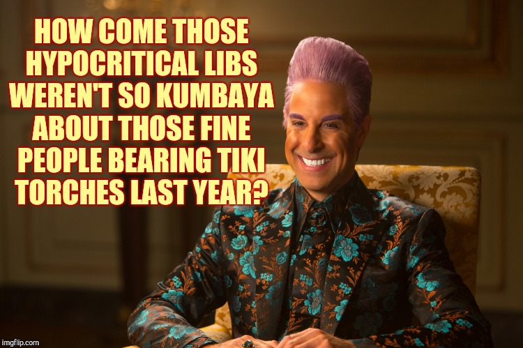 Hunger Games/Caesar Flickerman (Stanley Tucci) "heh heh heh" | HOW COME THOSE HYPOCRITICAL LIBS WEREN'T SO KUMBAYA ABOUT THOSE FINE PEOPLE BEARING TIKI TORCHES LAST YEAR? | image tagged in hunger games/caesar flickerman stanley tucci heh heh heh | made w/ Imgflip meme maker