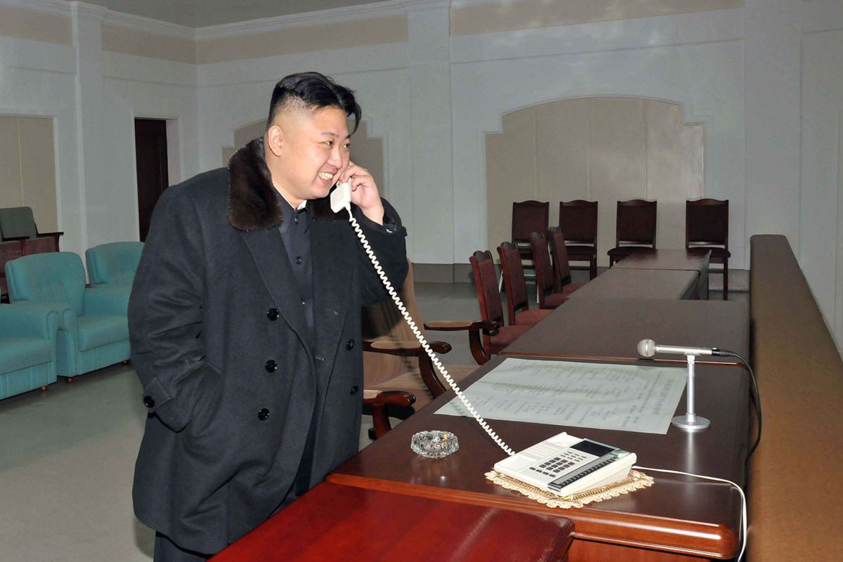 High Quality Kim Jong Un phone smiling HD Blank Meme Template