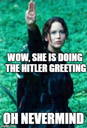 Hunger games | WOW, SHE IS DOING THE HITLER GREETING; OH NEVERMIND | image tagged in hunger games | made w/ Imgflip meme maker