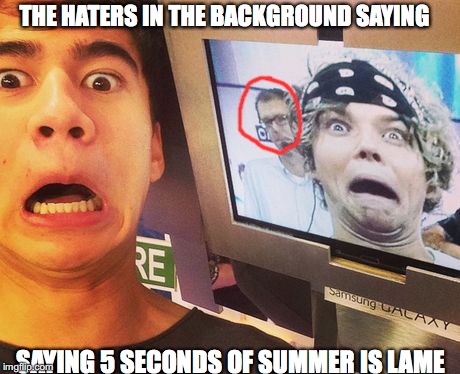 Calum Surprised  | THE HATERS IN THE BACKGROUND SAYING; SAYING 5 SECONDS OF SUMMER IS LAME | image tagged in calum surprised | made w/ Imgflip meme maker