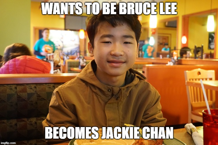 No offense to Jackie Chan | WANTS TO BE BRUCE LEE; BECOMES JACKIE CHAN | image tagged in bruce lee looking kid in a restaurant | made w/ Imgflip meme maker