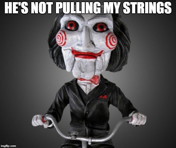 Saw puppet | HE'S NOT PULLING MY STRINGS | image tagged in saw puppet | made w/ Imgflip meme maker