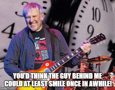 YOU'D THINK THE GUY BEHIND ME COULD AT LEAST SMILE ONCE IN AWHILE! | image tagged in rock and roll | made w/ Imgflip meme maker