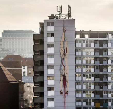Building murals in Brussel showing children sacrificing. Blank Meme Template