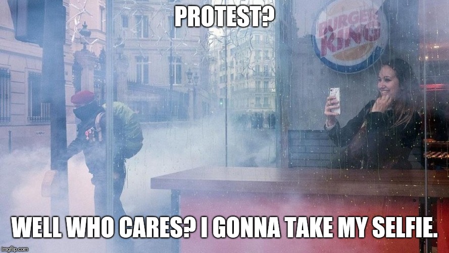 Protest? | PROTEST? WELL WHO CARES? I GONNA TAKE MY SELFIE. | image tagged in paris,protest,macron,emmanuel macron | made w/ Imgflip meme maker