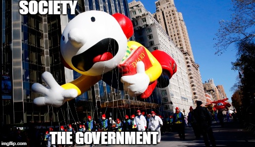 A visual of society | SOCIETY; THE GOVERNMENT | image tagged in conspiracy,government,parade,float,balloon,memes | made w/ Imgflip meme maker