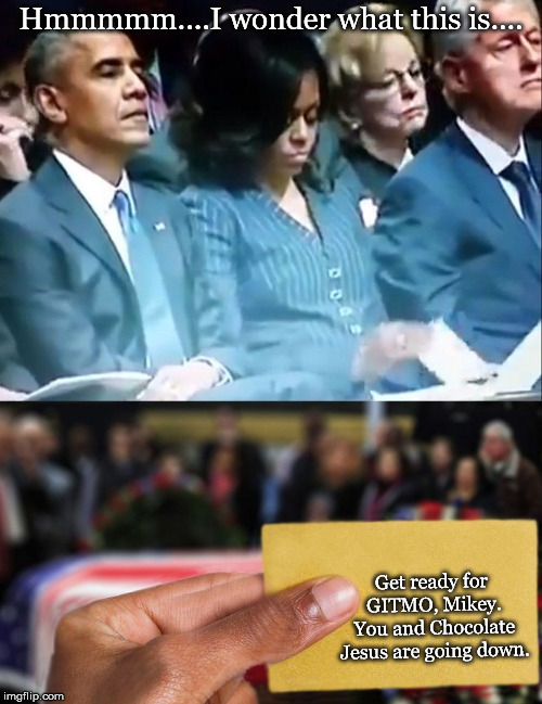 Michelle Obama | Hmmmmm....I wonder what this is.... Get ready for GITMO, Mikey. You and Chocolate Jesus are going down. | image tagged in michelle obama | made w/ Imgflip meme maker