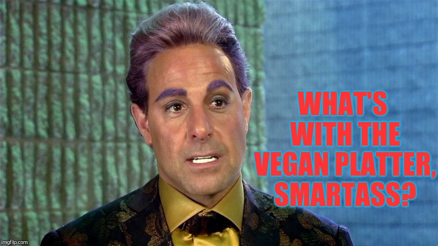 Hunger Games - Caesar Flickerman (Stanley Tucci) | WHAT'S WITH THE VEGAN PLATTER, SMARTASS? | image tagged in hunger games - caesar flickerman stanley tucci | made w/ Imgflip meme maker