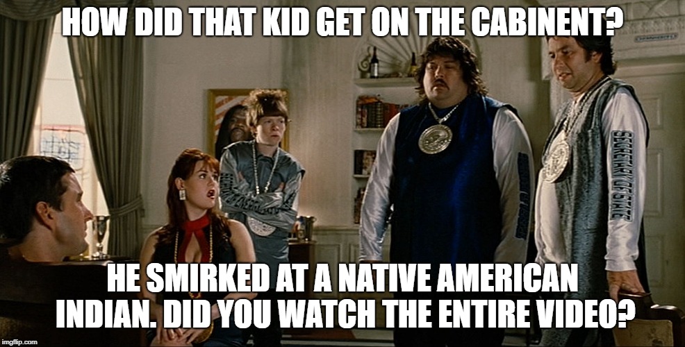 idiocracy | HOW DID THAT KID GET ON THE CABINENT? HE SMIRKED AT A NATIVE AMERICAN INDIAN. DID YOU WATCH THE ENTIRE VIDEO? | image tagged in idiocracy | made w/ Imgflip meme maker