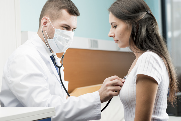 Doctor examining woman with stethoscope Blank Meme Template