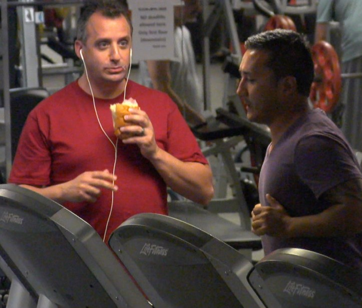 joe watching guy on treadmill while eating at gym Blank Meme Template
