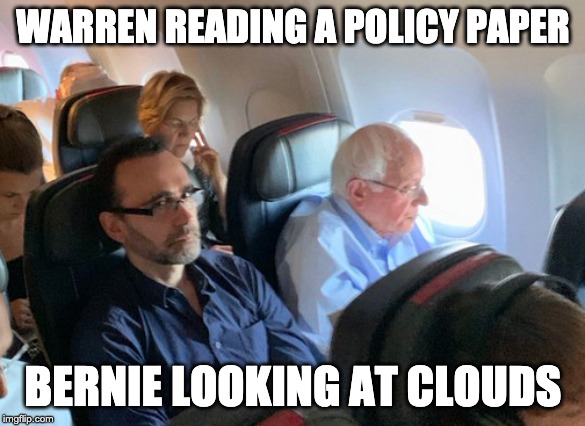 Warren Right Behind Sanders | WARREN READING A POLICY PAPER; BERNIE LOOKING AT CLOUDS | image tagged in warren right behind sanders | made w/ Imgflip meme maker