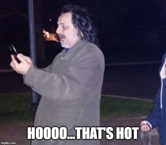 Fire breathing man | HOOOO...THAT'S HOT | image tagged in fire breathing man | made w/ Imgflip meme maker