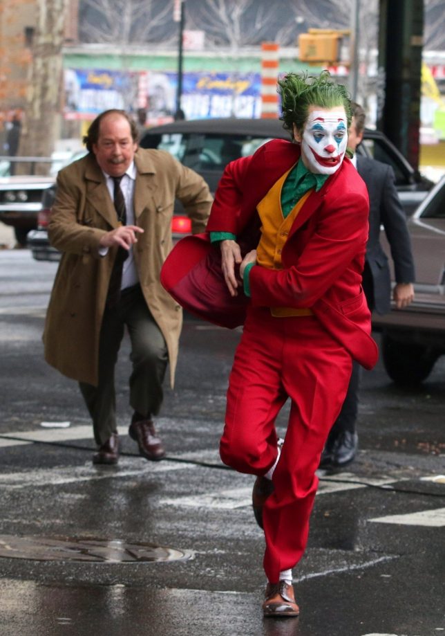 Joker chased by security Blank Meme Template