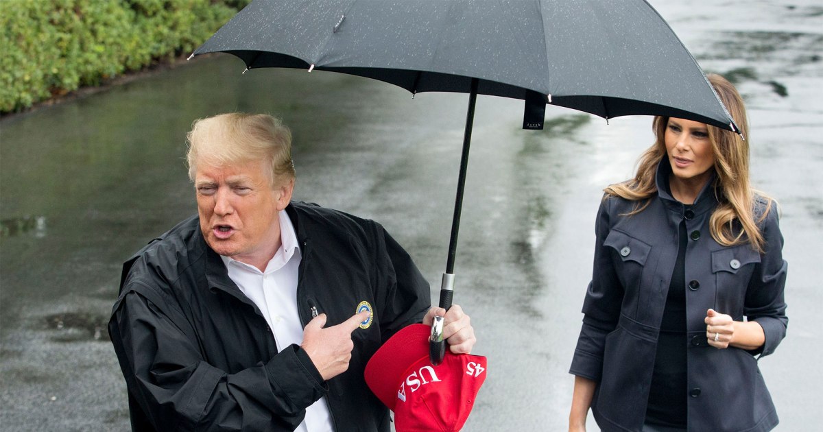 Trump dry under umbrella Melania soaking wet in the rain Blank Meme Template