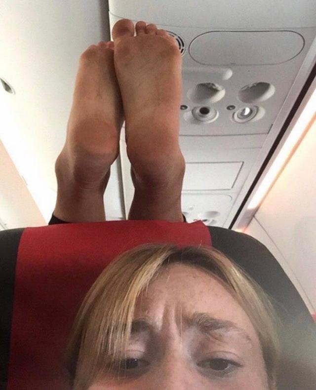 High Quality Stinky Dirty Feet dangling over your headrest on a plane. Blank Meme Template