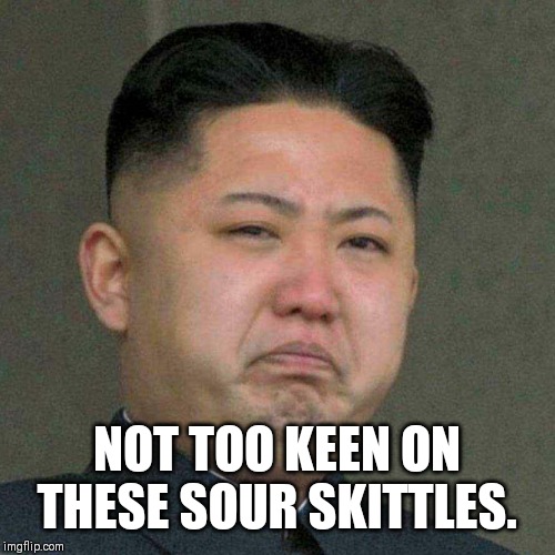 Sour Skittles | NOT TOO KEEN ON THESE SOUR SKITTLES. | image tagged in kim jong un,skittles,north korea | made w/ Imgflip meme maker