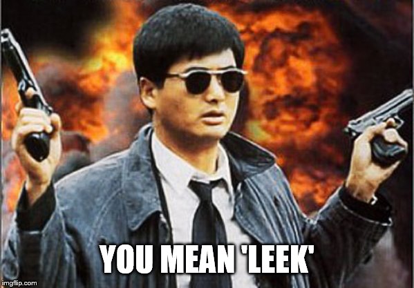 Asian man with gun | YOU MEAN 'LEEK' | image tagged in asian man with gun | made w/ Imgflip meme maker