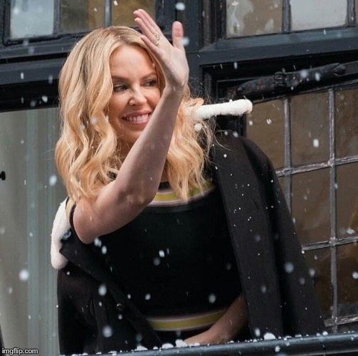 Non-denominational Winter’s greetings from Kylie. (#WarOnChristmas Edition) | image tagged in kylie snow wave,winter,snow,happy holidays,waving,celebrity | made w/ Imgflip meme maker