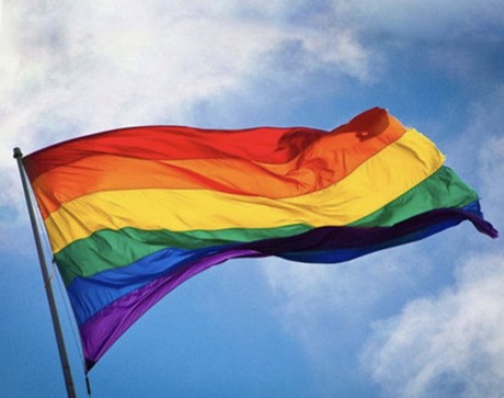 Gay pride flag waving, against sky Blank Meme Template