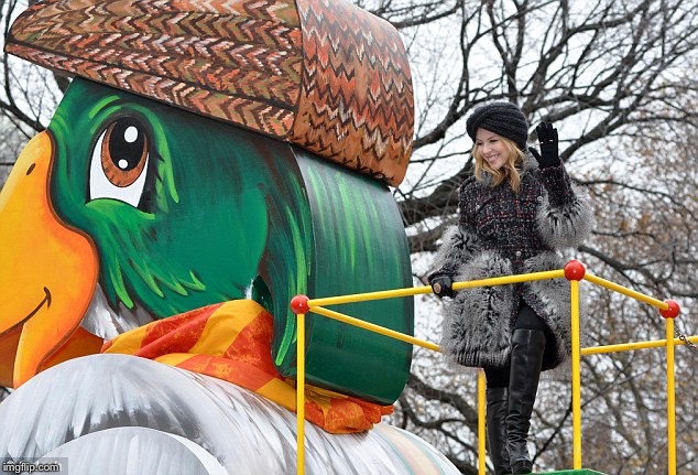 Kylie on Duck float for Macy’s Thanksgiving Day parade. I captioned this photo for a ProductiveDuck tribute. | image tagged in kylie duck,thanksgiving,singer,celebrity,duck,parade | made w/ Imgflip meme maker