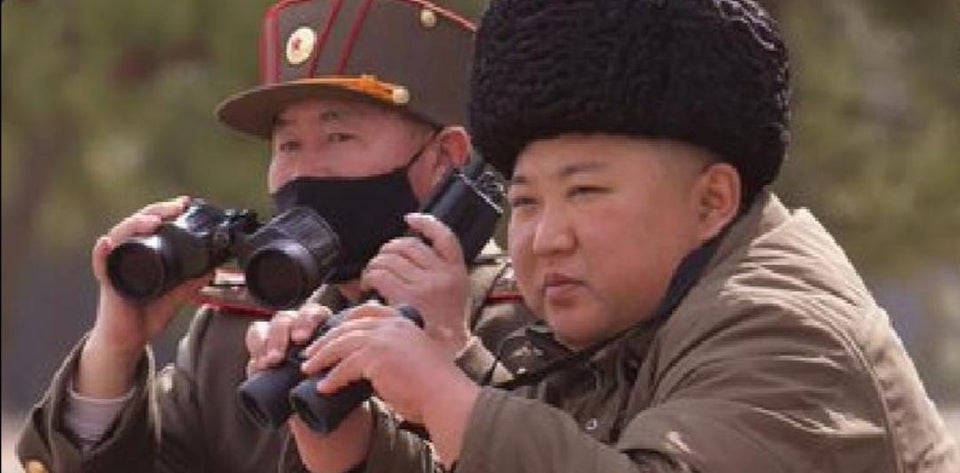 kim jong un looking at something Blank Meme Template