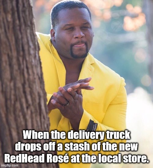 Black guy hiding behind tree | When the delivery truck drops off a stash of the new RedHead Rosé at the local store. | image tagged in black guy hiding behind tree | made w/ Imgflip meme maker