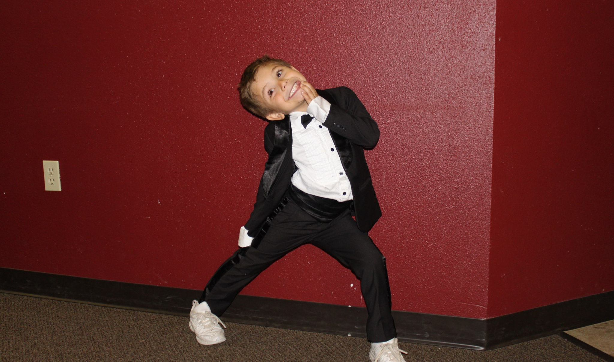 Excited boy in tux Blank Meme Template