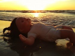Baby doll on beach Meme Template