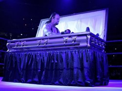 Undertaker in coffin Meme Template