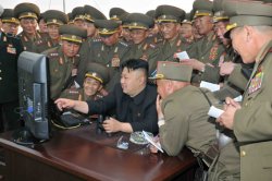 Kim Jong Un pointing at screen Meme Template