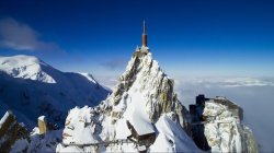 House on top of mountain in the Alps Meme Template