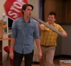 Gibby hitting Specner with a stop sign Meme Template