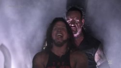 Undertaker teleports behind AJ Styles Meme Template