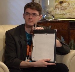 Jschlatt holding notepad Meme Template