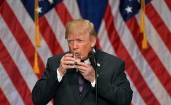 Trump drinks glass of water with both hands Meme Template