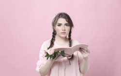 woman-holding-roses-impressed-by-book Meme Template
