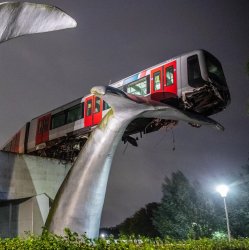 Train accidentally landing in public art Meme Template