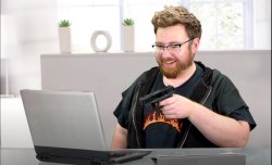 Tomska aiming gun at laptop. Meme Template