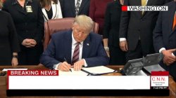 trump signs pardon Meme Template