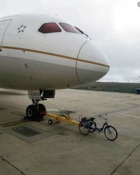 Bike pulling plane Meme Template