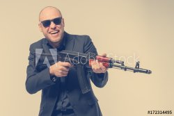 Bald guy with machine gun Meme Template