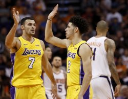 Larry Nance Jr. and Lonzo Ball slapping it up Meme Template