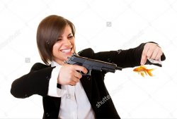 Woman holding goldfish pointing gun at it Meme Template