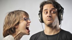 Woman screaming at man wearing headphones Meme Template