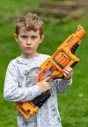 Kid with nerf gun Meme Template